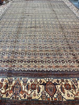 AN ANTIQUE HAMEDAN RUG