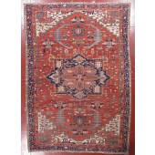 AN ANTIQUE HERIZ RUG