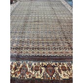 AN ANTIQUE HAMEDAN RUG